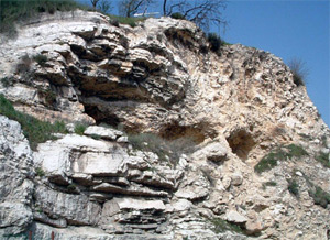 The scripture tells us that Jesus, carrying his own cross, went out to Golgotha (which means Place of a Skull). Here they crucified Him. There are no details as to the exact location of Golgotha but some believe it was possibly at the location pictured above. You can see the image of a skull on the mountain. Outside the city of Jerusalem on a hill. Photo by T. Keener.